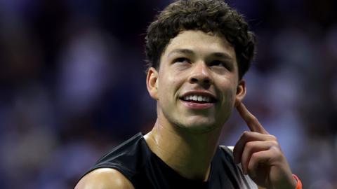 Ben Shelton smiles after winning his US Open semi-final