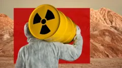 ተራራ እና የኒውክሌር ቁስ የተሸከመ ሰው